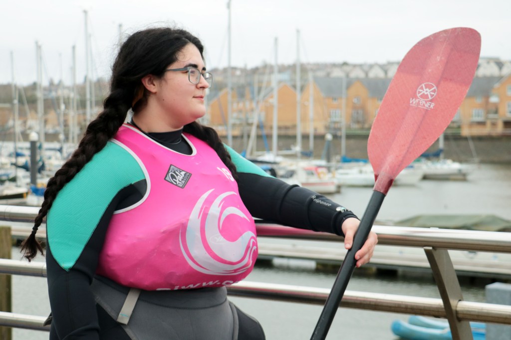 A person sitting on a bench

Description automatically generated